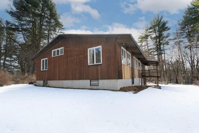 a backyard of a house with large trees