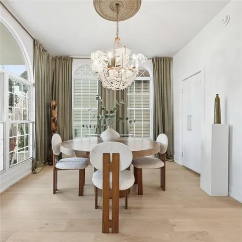 a dining room with furniture and window