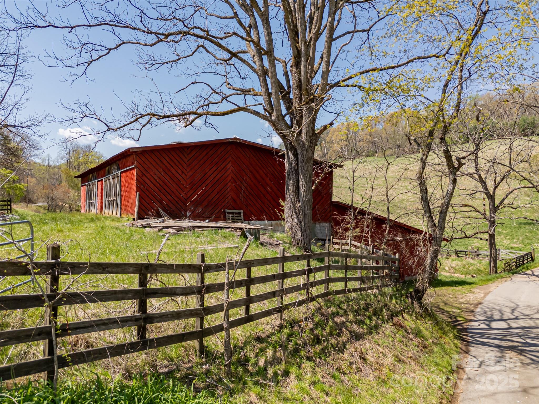 435 Upper Glady Fork Road Candler, NC 28715 - Photo 16 of 47 a view of a wooden house with a yard