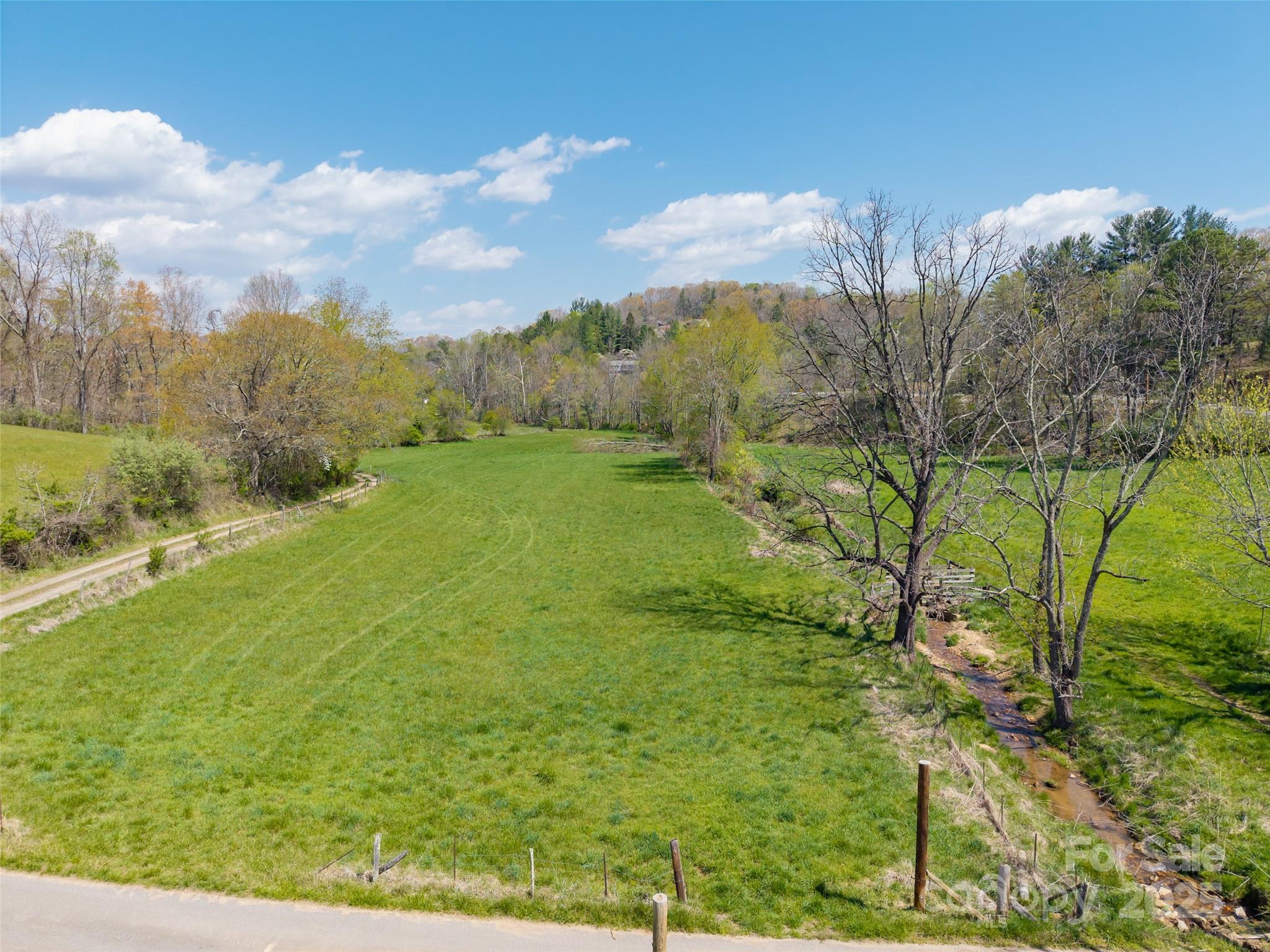 435 Upper Glady Fork Road Candler, NC 28715 - Photo 20 of 47 a view of an outdoor space and a yard