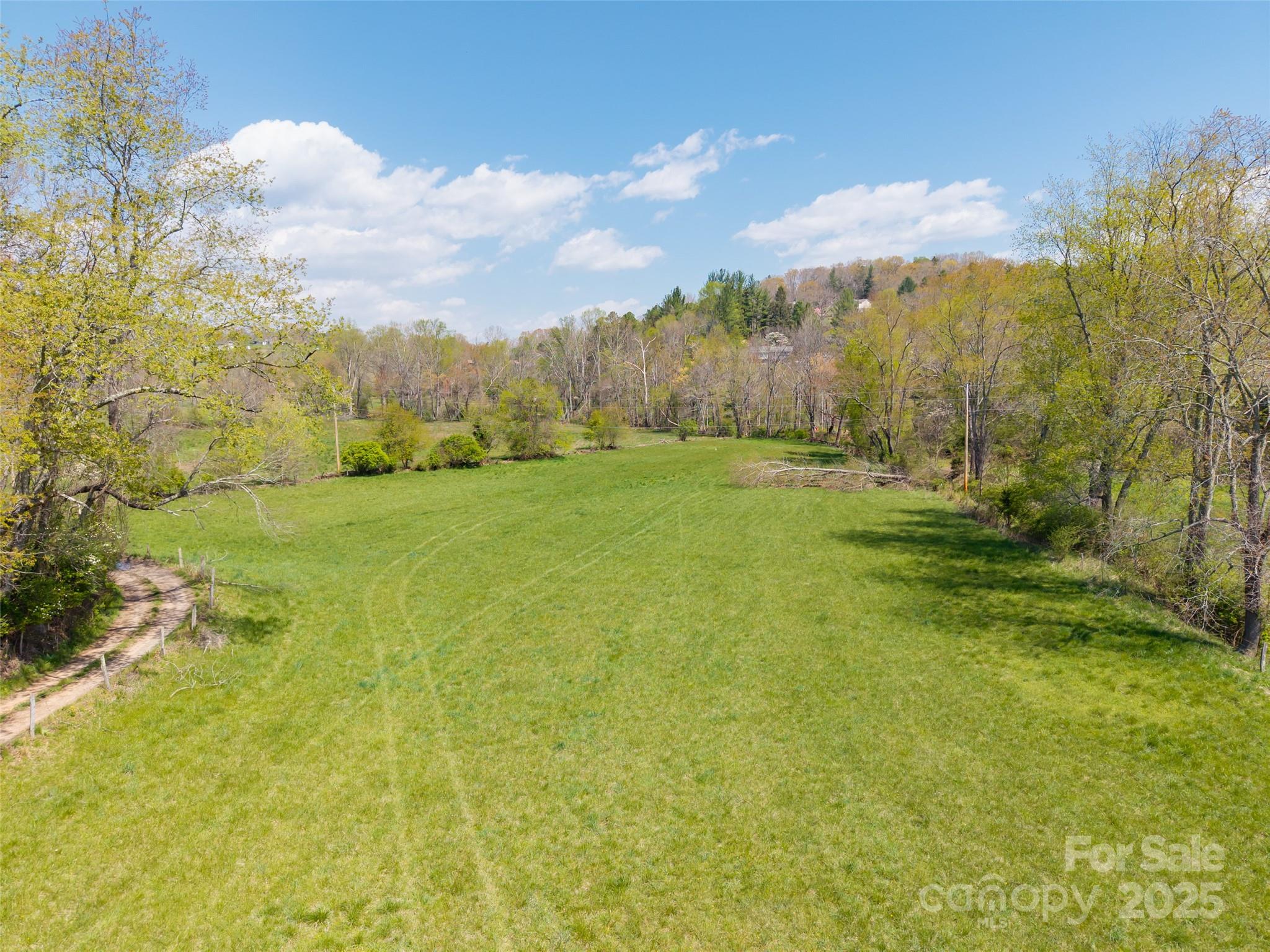435 Upper Glady Fork Road Candler, NC 28715 - Photo 21 of 47 a view of an outdoor space and a yard