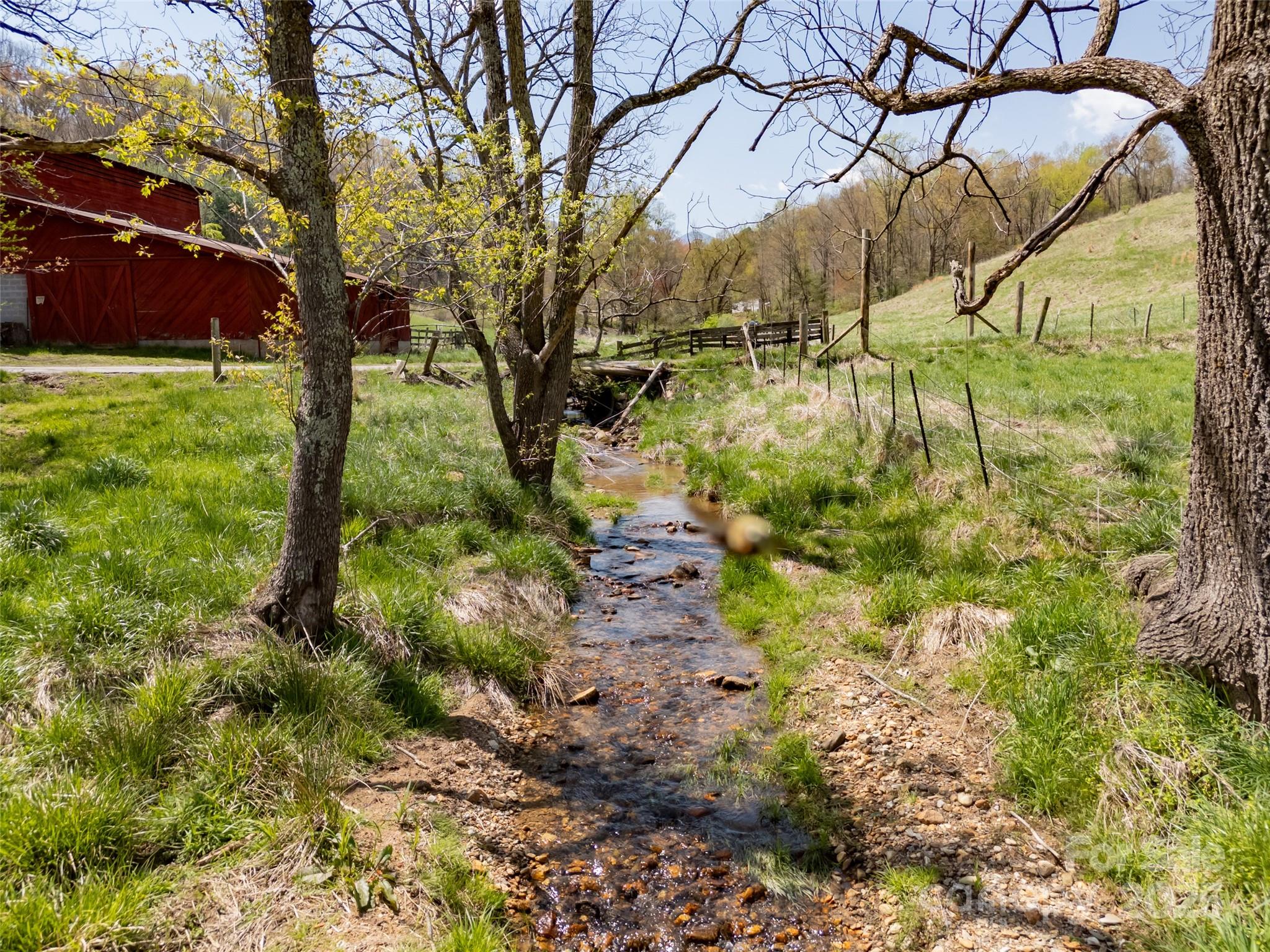 435 Upper Glady Fork Road Candler, NC 28715 - Photo 30 of 47 a backyard of a house with lots of green space