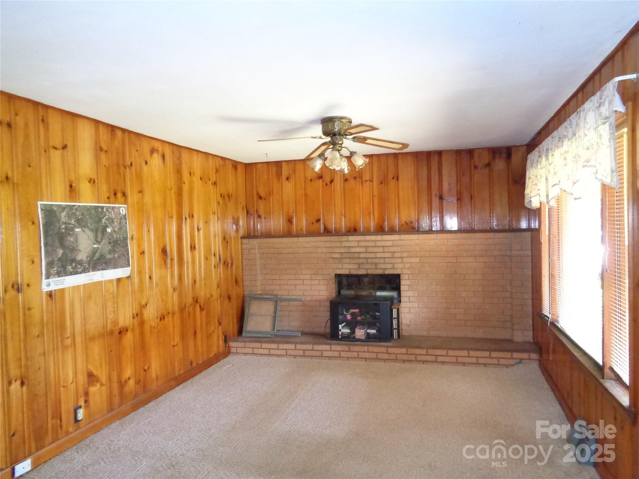 435 Upper Glady Fork Road Candler, NC 28715 - Photo 34 of 47 a view of a livingroom with a fireplace and a window