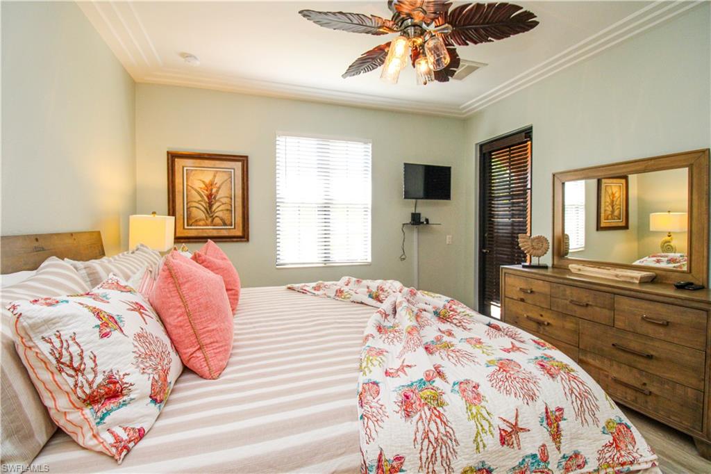 9159 Delano Street, Unit 9905 Naples, FL 34113 - Photo 31 of 44 Bedroom featuring ceiling fan and crown molding