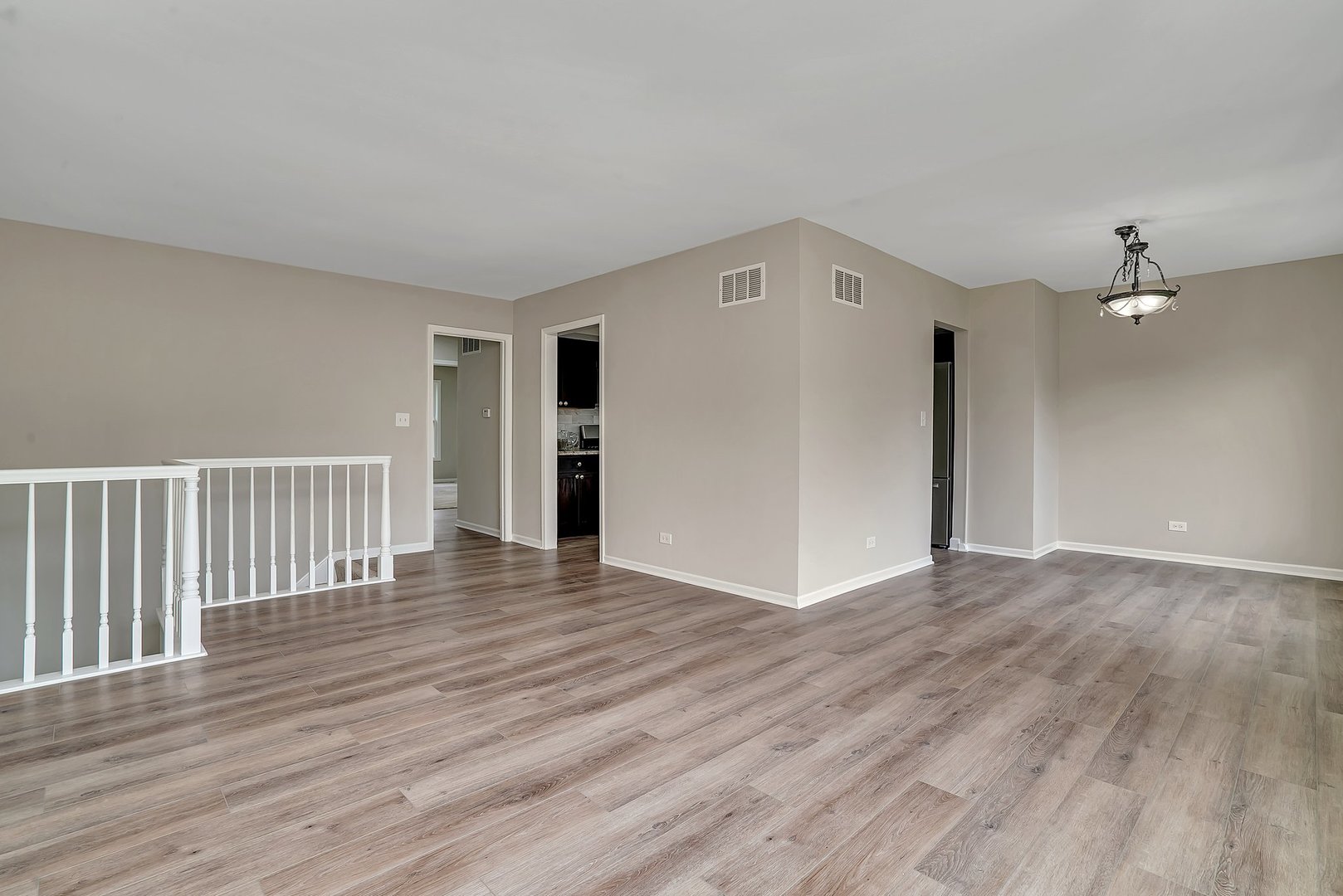 161 South Schmidt Road Bolingbrook, IL 60440 - Photo 12 of 26 a view of an empty room with wooden floor and a window