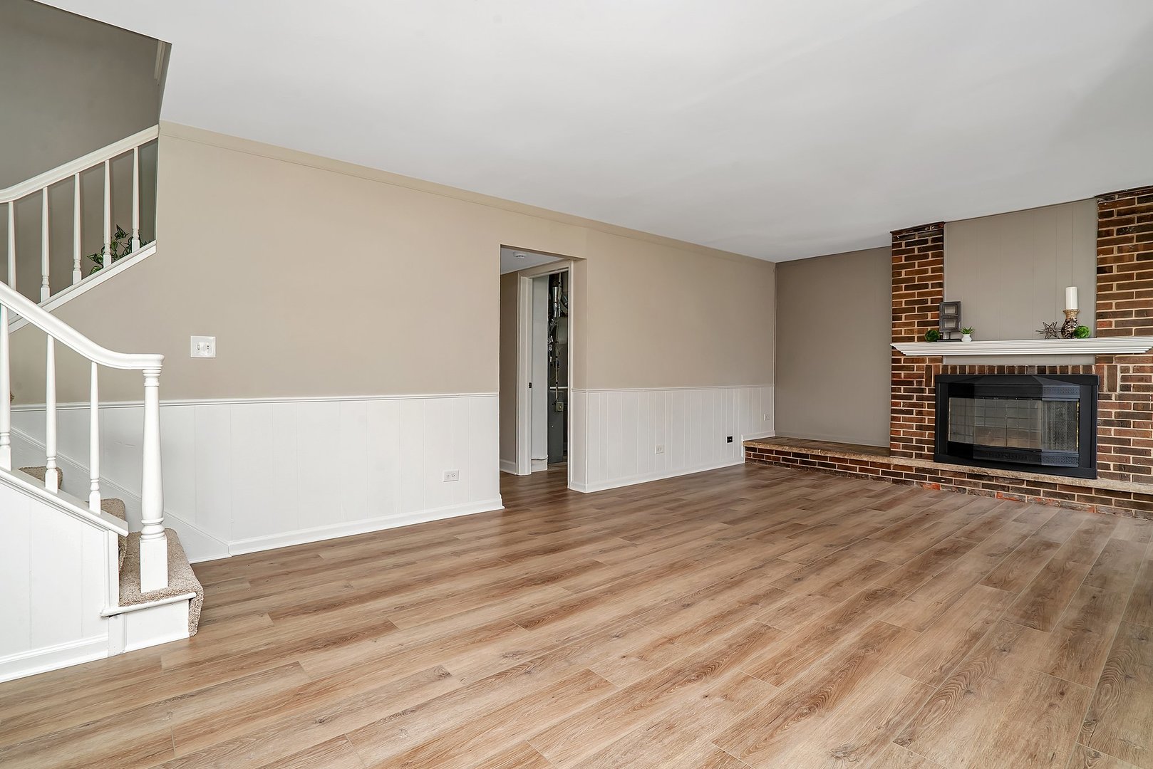 161 South Schmidt Road Bolingbrook, IL 60440 - Photo 15 of 26 a view of empty room with wooden floor and fireplace