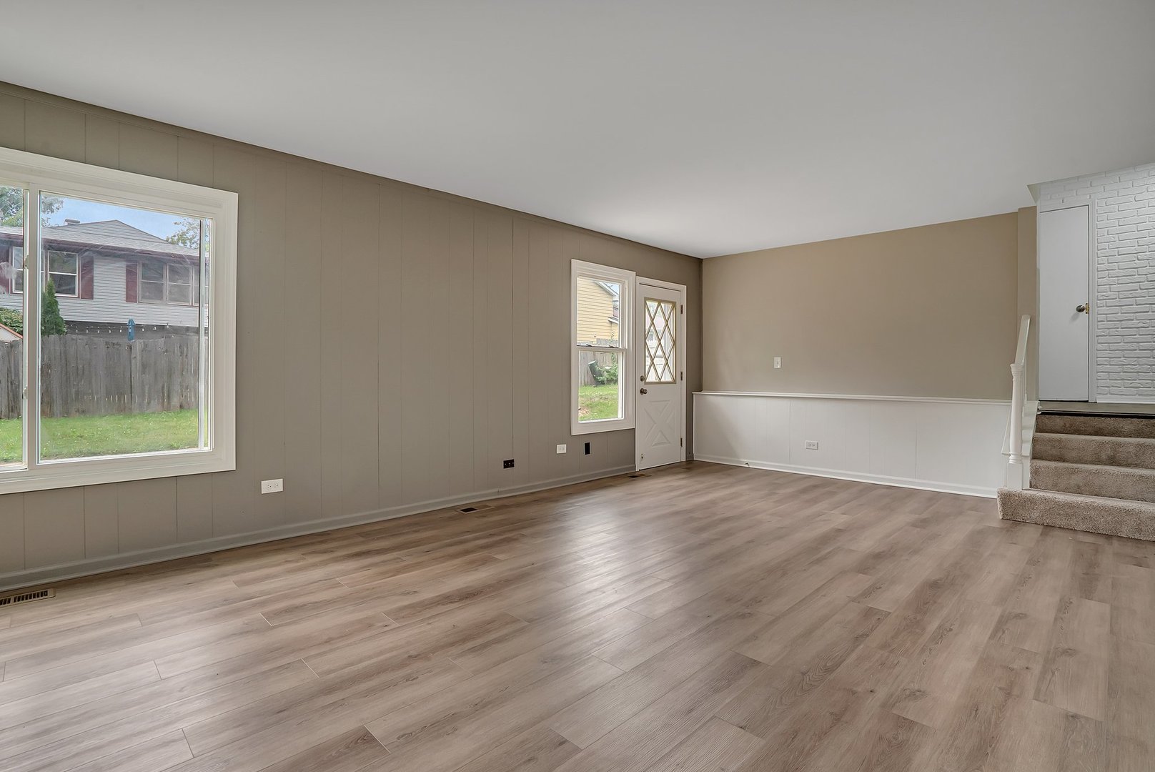 161 South Schmidt Road Bolingbrook, IL 60440 - Photo 16 of 26 a view of an empty room with wooden floor and a window