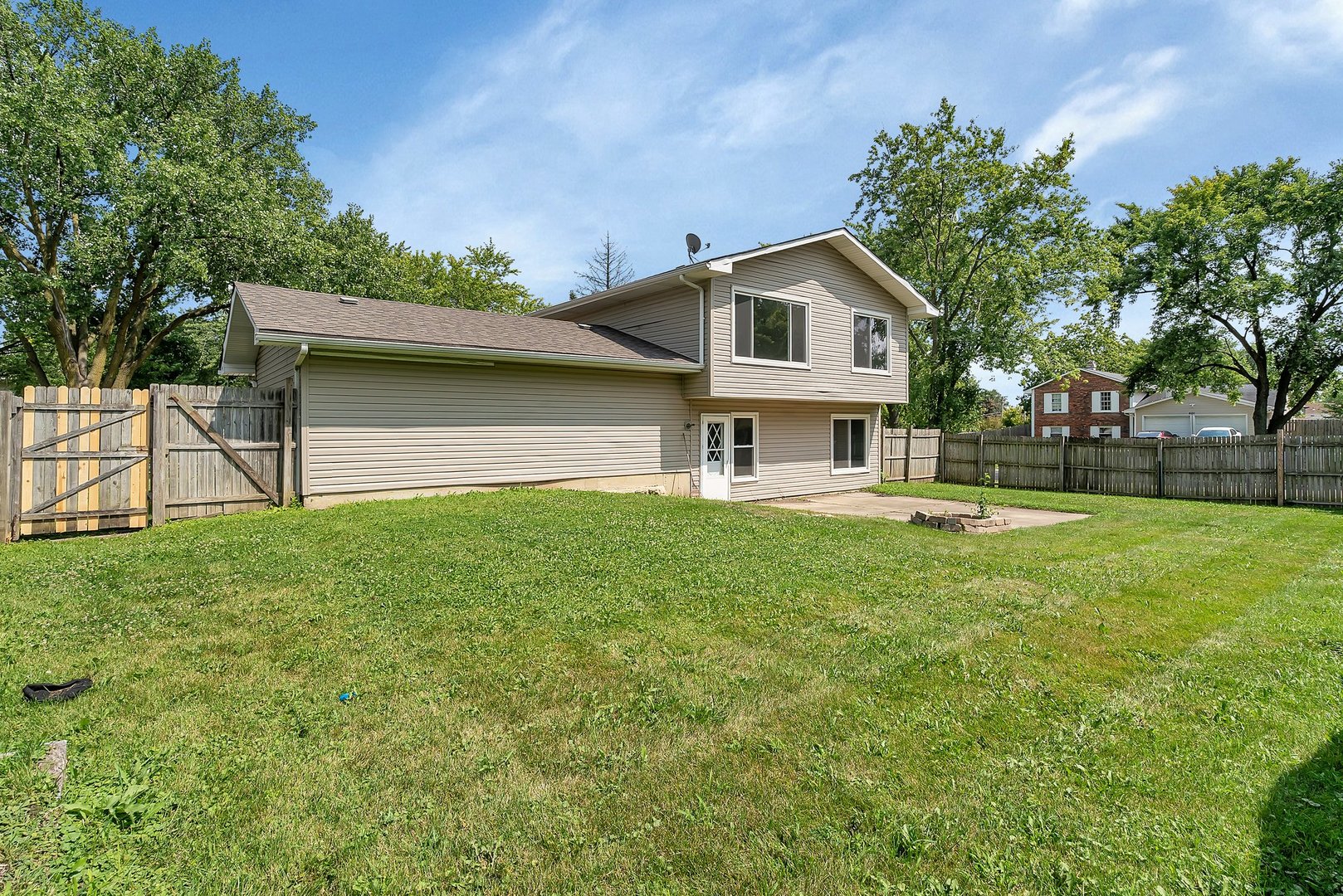 161 South Schmidt Road Bolingbrook, IL 60440 - Photo 24 of 26 a front view of house with yard and trees