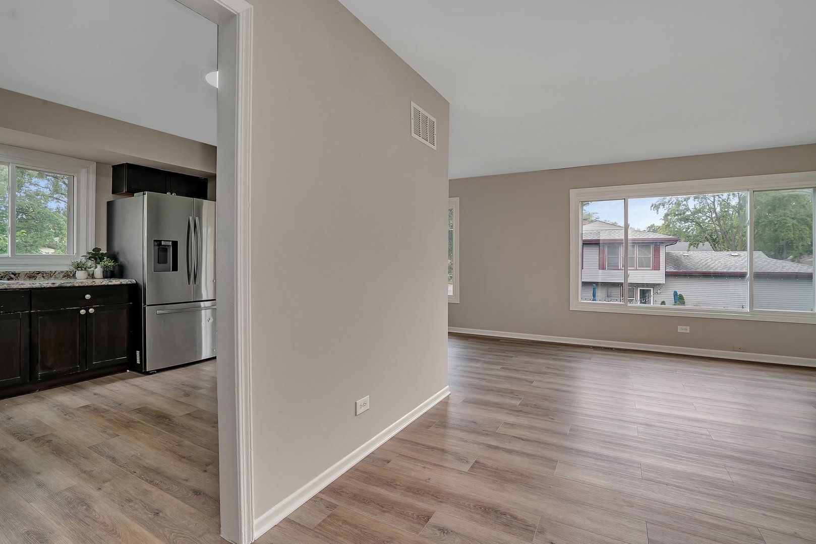 161 South Schmidt Road Bolingbrook, IL 60440 - Photo 3 of 26 a view of a kitchen with a sink and a window