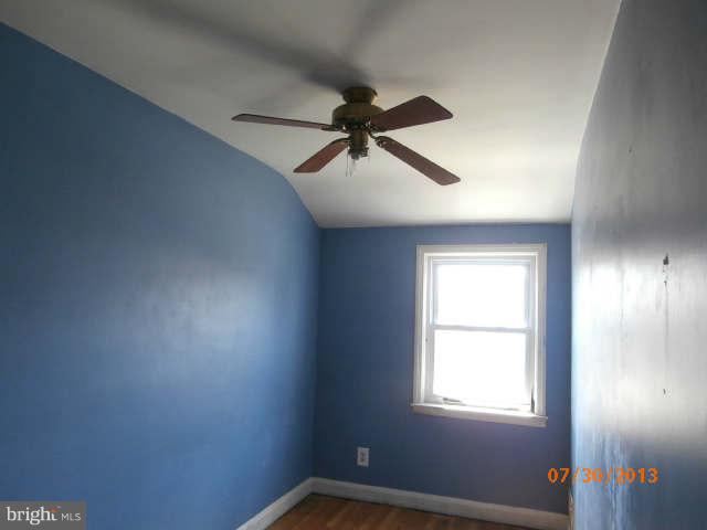 1026 Arncliffe Road Essex, MD 21221 - Photo 11 of 17 an empty room with a window and a fan