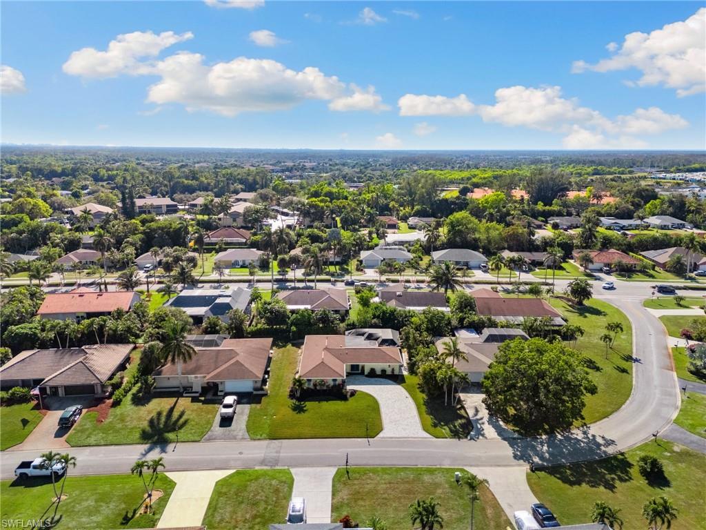 230 Pine Valley Circle Naples, FL 34113 - Photo 38 of 40 an aerial view of residential houses with outdoor space