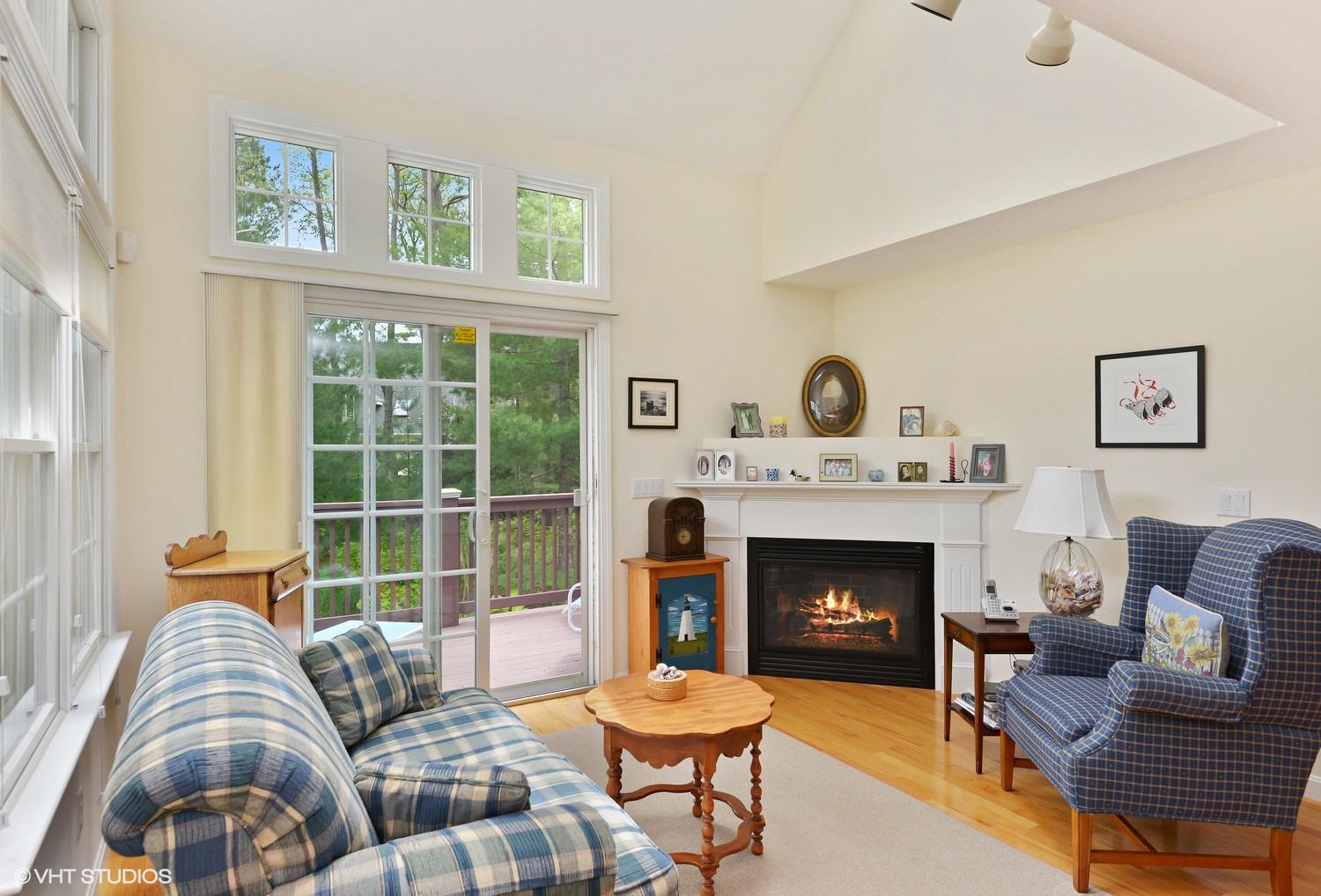 23 Gold Leaf Lane Mashpee, MA 02649 - Photo 3 of 15 a living room with furniture a fireplace and a large window