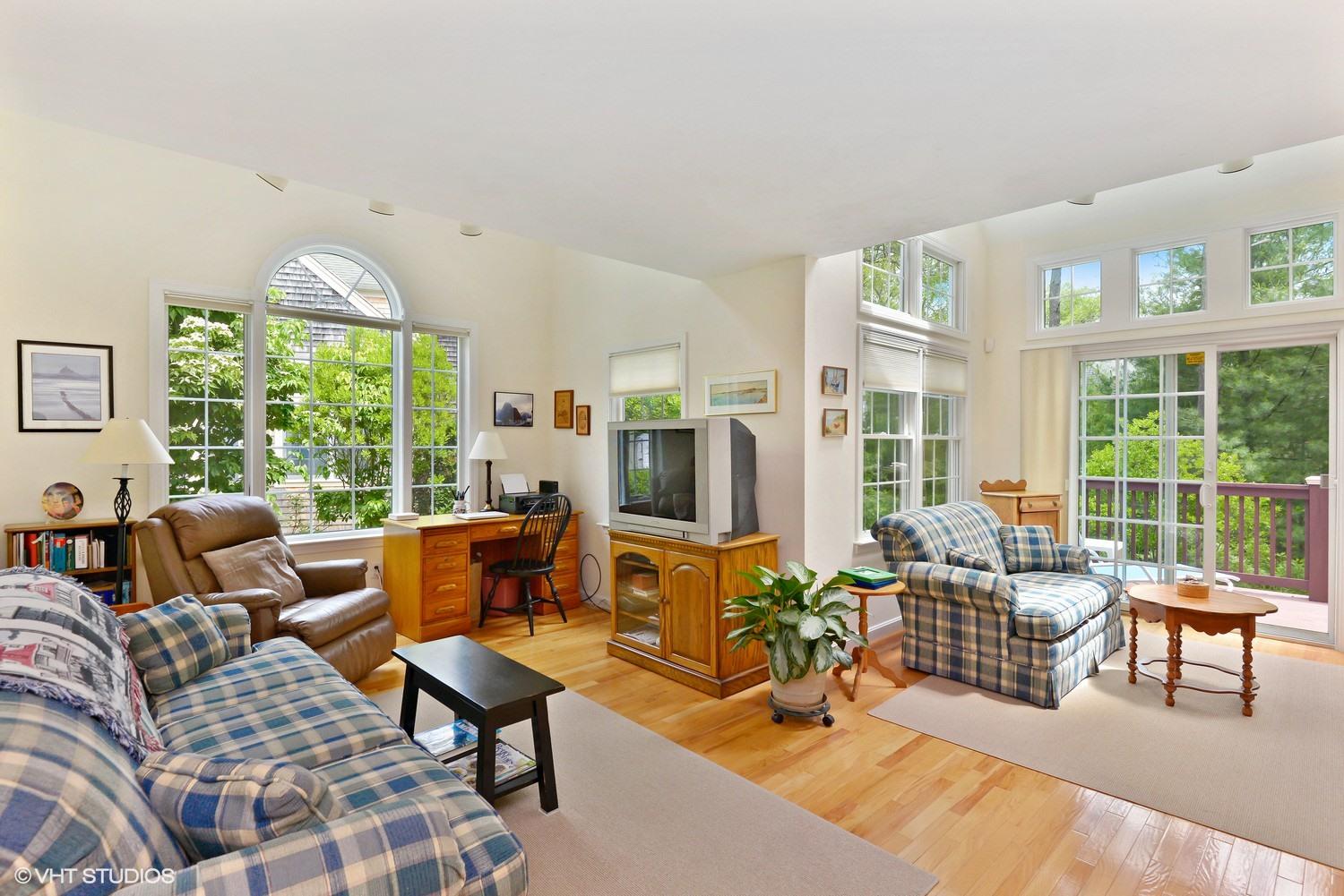 23 Gold Leaf Lane Mashpee, MA 02649 - Photo 4 of 15 a living room with furniture tv and large windows