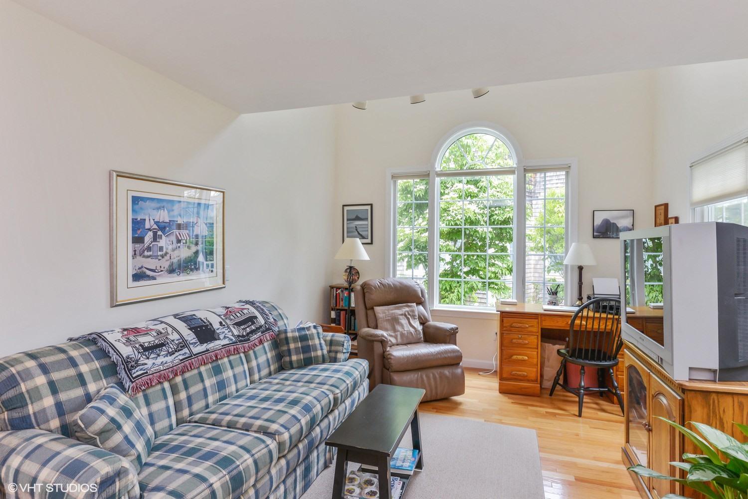 23 Gold Leaf Lane Mashpee, MA 02649 - Photo 5 of 15 a living room with furniture a large window and a chandelier