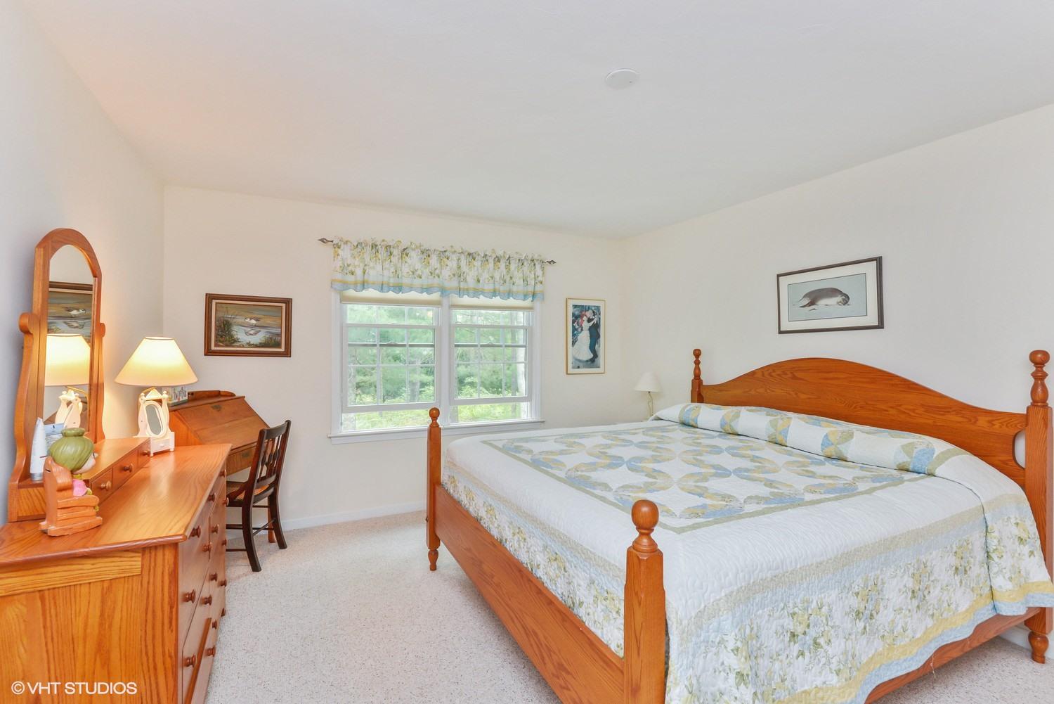 23 Gold Leaf Lane Mashpee, MA 02649 - Photo 8 of 15 a bed room with a bed and a chair