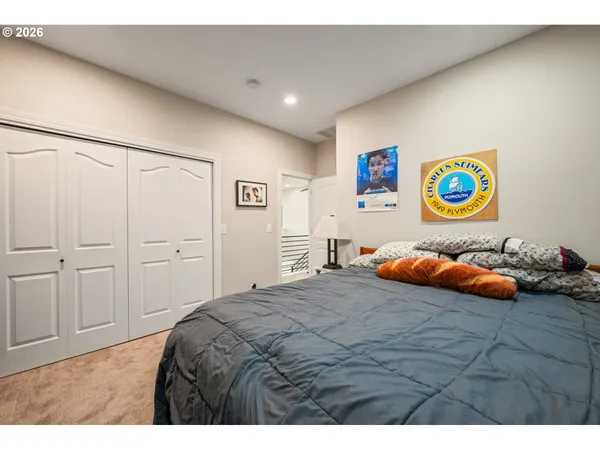 a bedroom with a bed and a area