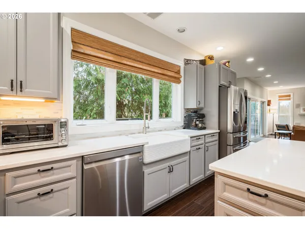 a kitchen with a sink stove and refrigerator