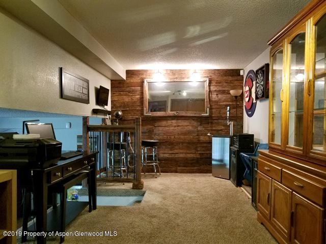 515 East 11th Street Rifle, CO 81650 - Photo 14 of 23 a kitchen with a refrigerator and a stove top oven