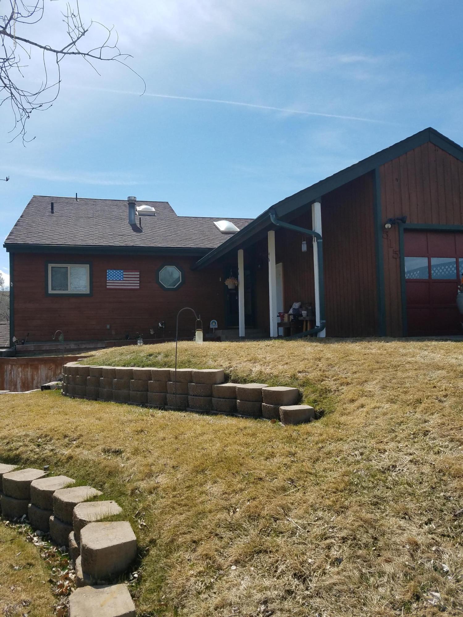515 East 11th Street Rifle, CO 81650 - Photo 2 of 23 a view of swimming pool with an outdoor space