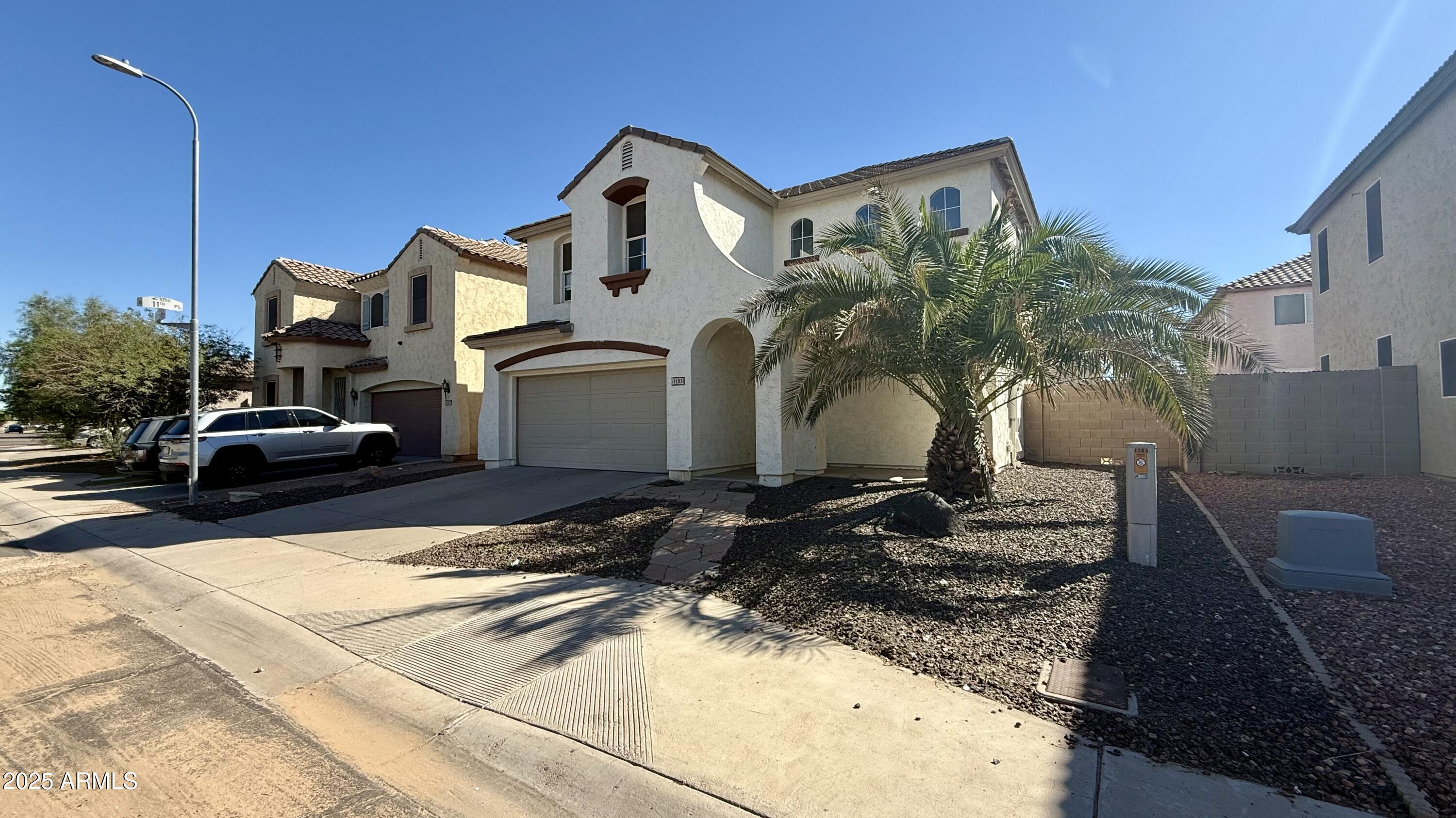 1103 East Grove Street Phoenix, AZ 85040 - Photo 2 of 21 a view of a car park in front of a house