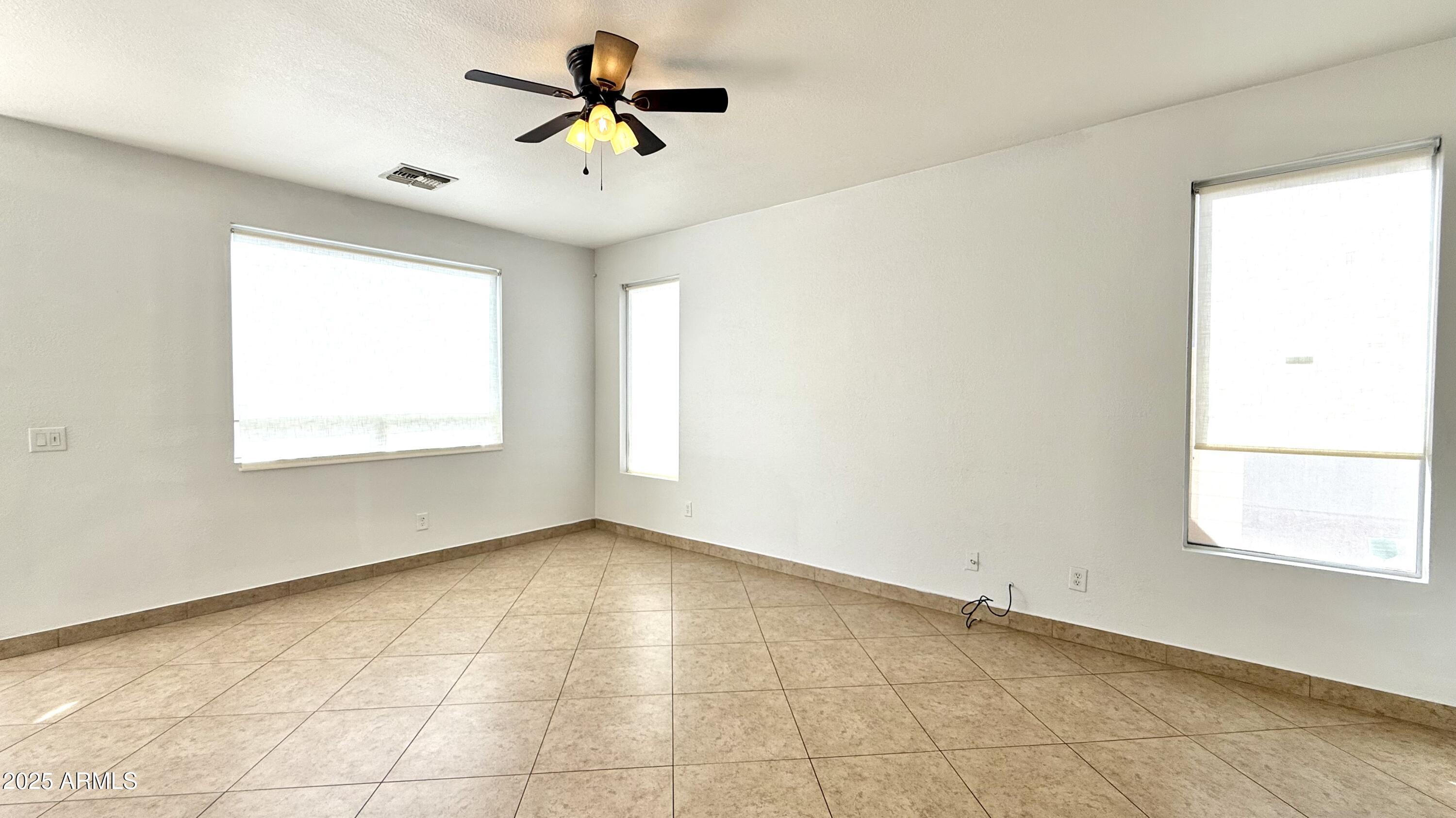 1103 East Grove Street Phoenix, AZ 85040 - Photo 6 of 21 a view of an empty room with a window