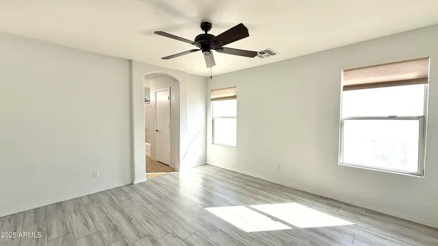 a bathroom with a granite countertop bathtub shower sink and mirror