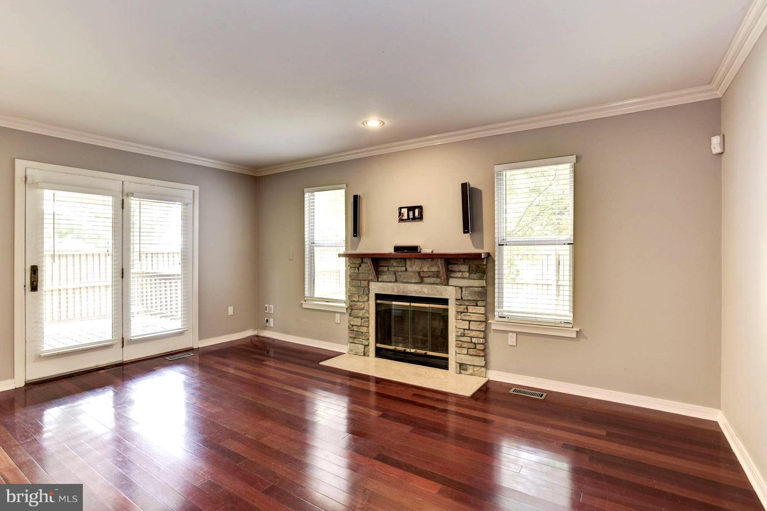1548 Ritchie Lane Annapolis, MD 21401 - Photo 14 of 30 Living Room with Gathering Fireplace / Deck Access