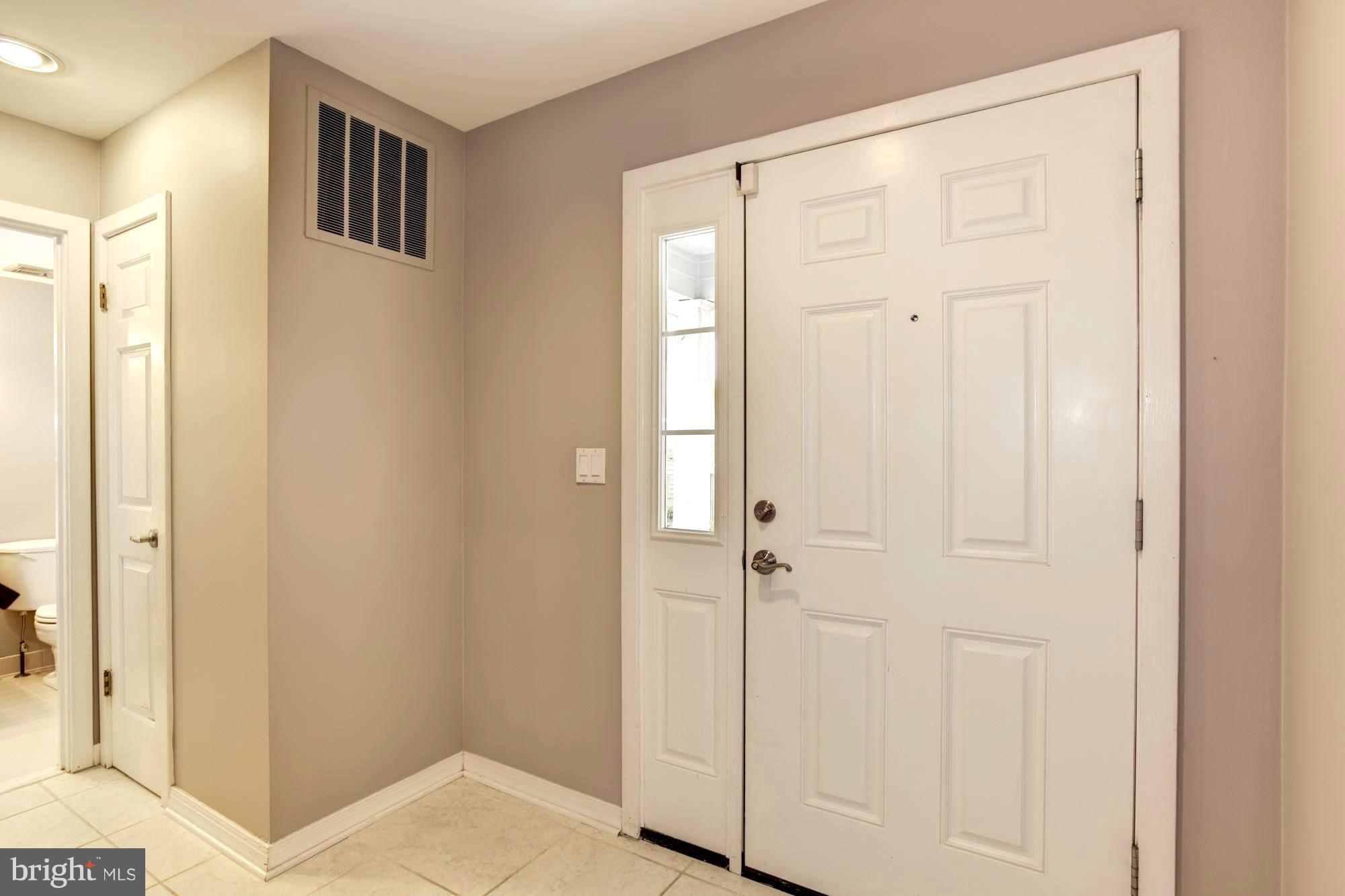 Welcoming Tile-Floored Entry / 6-Panel Doors