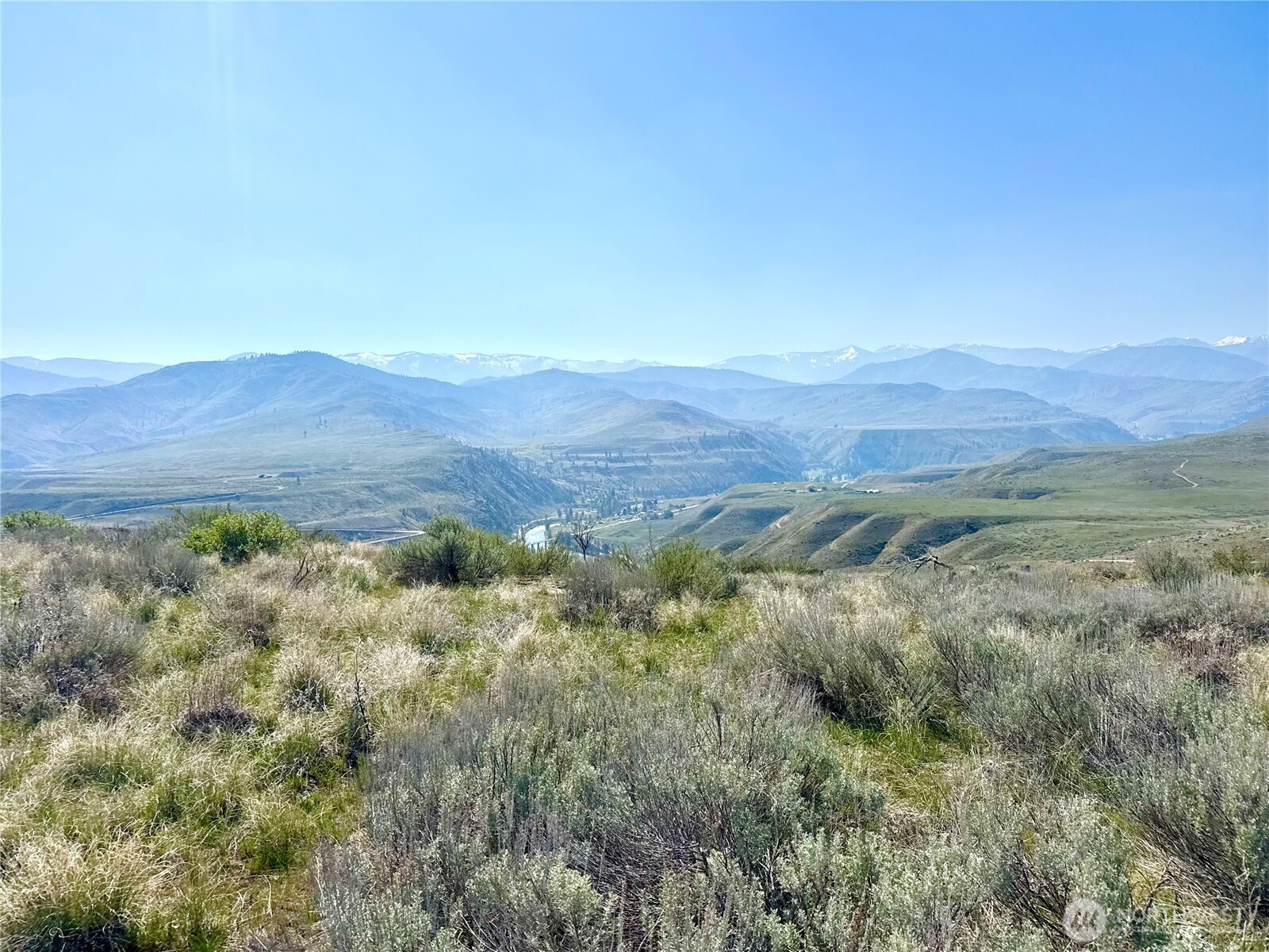 2 Riverbend Overlook Methow, WA 98834 - Photo 7 of 22 a view of a lush green hillside and a houses