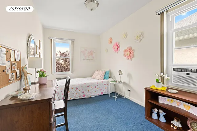 a bedroom with a bed and a table