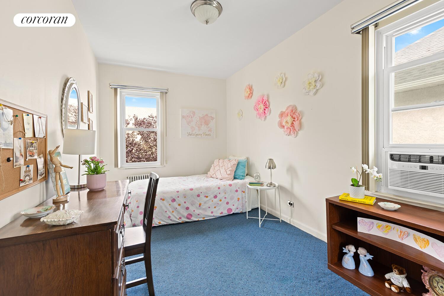 2401 Avenue R Brooklyn, NY 11229 - Photo 10 of 14 a bedroom with a bed and a table