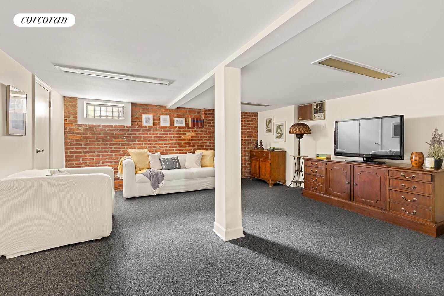 2401 Avenue R Brooklyn, NY 11229 - Photo 11 of 14 a living room with furniture and a large window