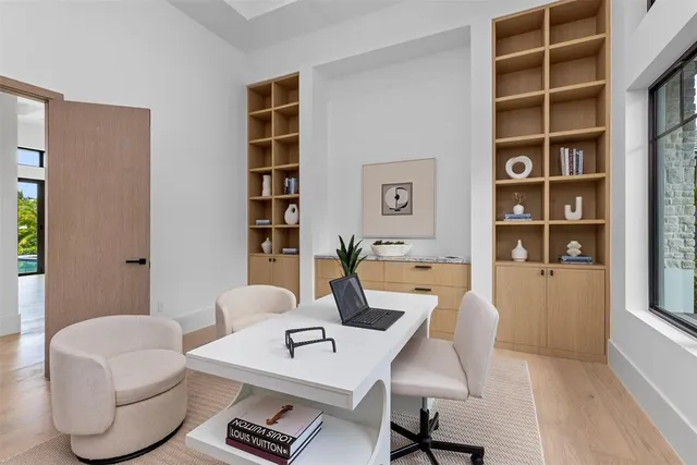 a living room with furniture and a potted plant