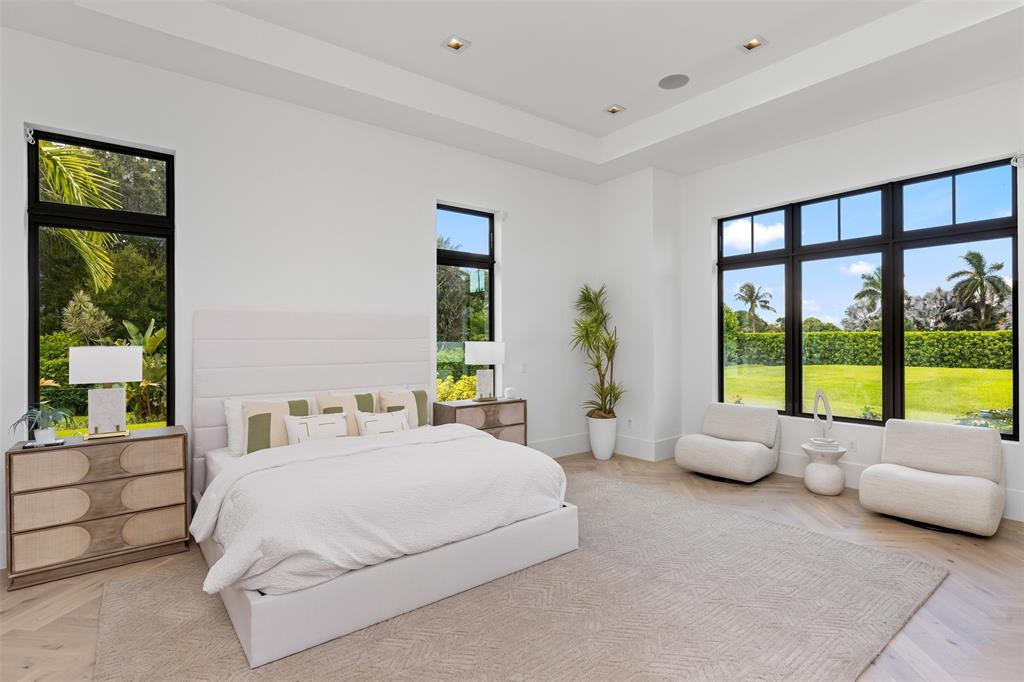 12701 Luray Road Southwest Ranches, FL 33330 - Photo 19 of 50 a spacious bedroom with a bed and a large window