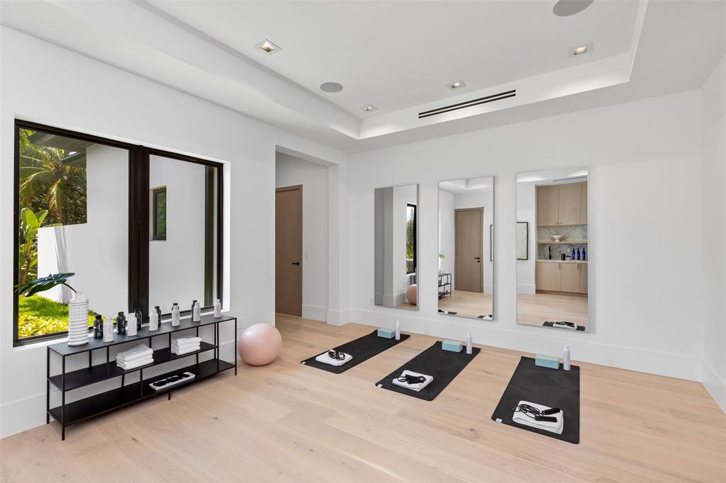 12701 Luray Road Southwest Ranches, FL 33330 - Photo 22 of 50 a room with gym equipment and a large window