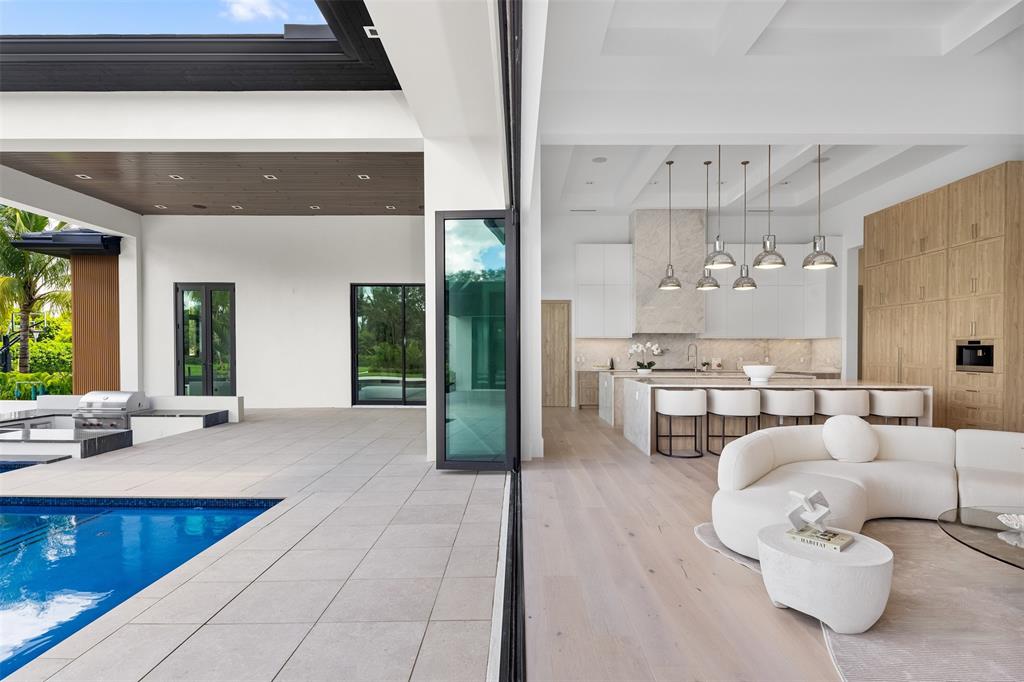 12701 Luray Road Southwest Ranches, FL 33330 - Photo 26 of 50 a living room with furniture and a kitchen appliance