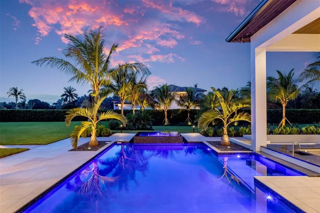 a large kitchen with kitchen island a sink appliances and a counter top space
