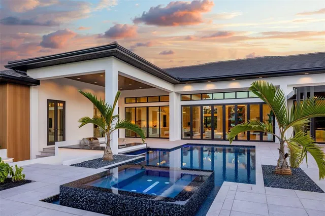 a kitchen with a sink and a large window