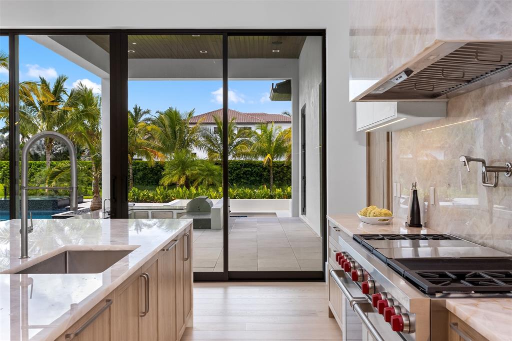 12701 Luray Road Southwest Ranches, FL 33330 - Photo 31 of 50 a kitchen with a sink and a large window