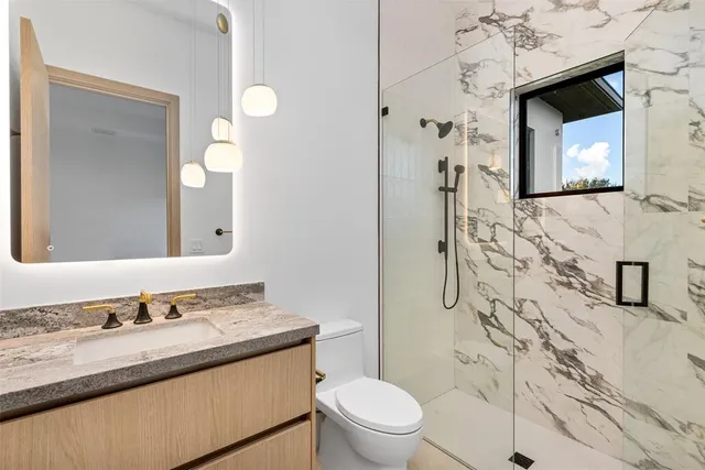 a utility room with sink dryer and washer