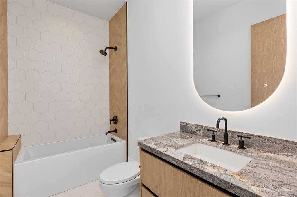 12701 Luray Road Southwest Ranches, FL 33330 - Photo 39 of 50 a bathroom with a granite countertop sink toilet and shower