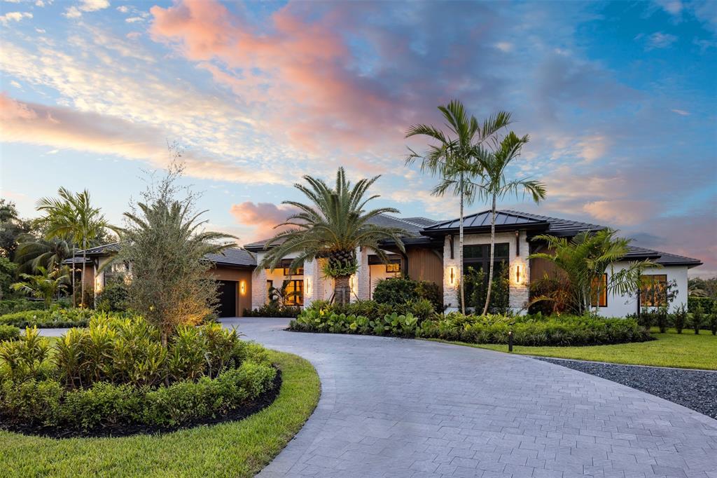 12701 Luray Road Southwest Ranches, FL 33330 - Photo 47 of 50 a front view of a house with a garden