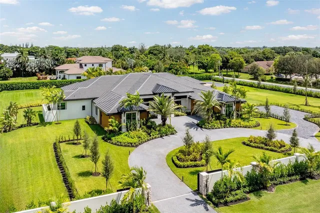 a view of a swimming pool with a yard