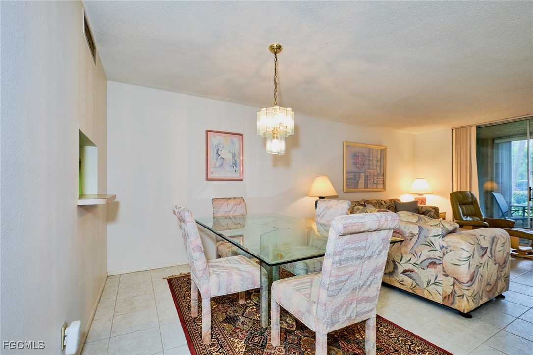 5959 Winkler Road, Unit 118 Fort Myers, FL 33919 - Photo 4 of 22 a living room with furniture and a window