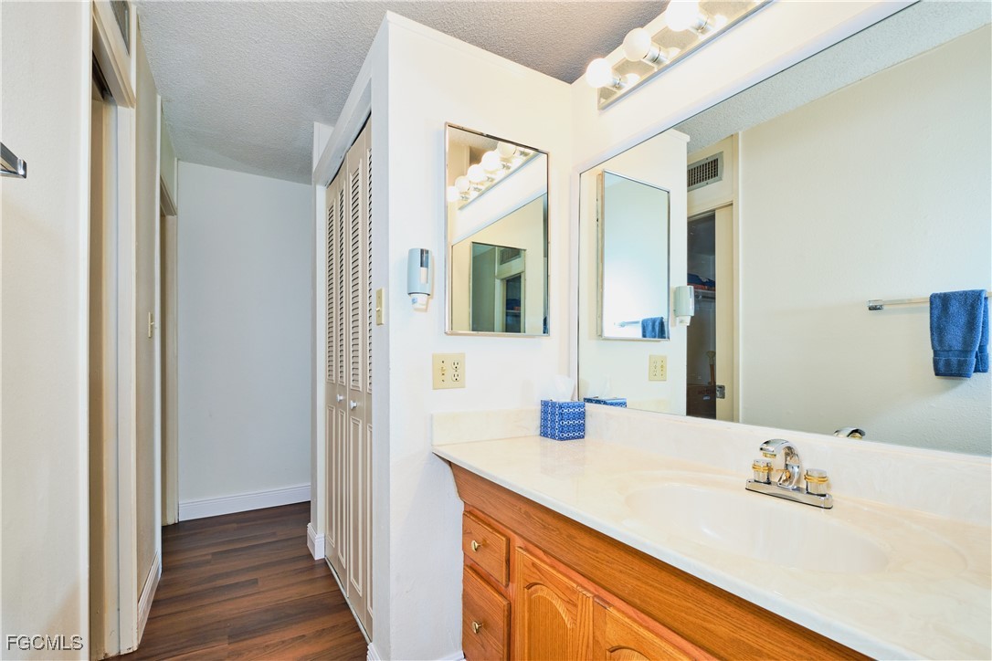 5959 Winkler Road, Unit 118 Fort Myers, FL 33919 - Photo 8 of 22 a bathroom with a sink and a mirror