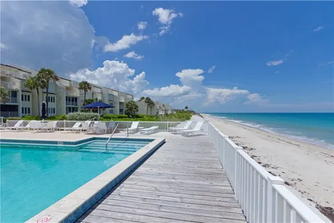 a view of a house with swimming pool