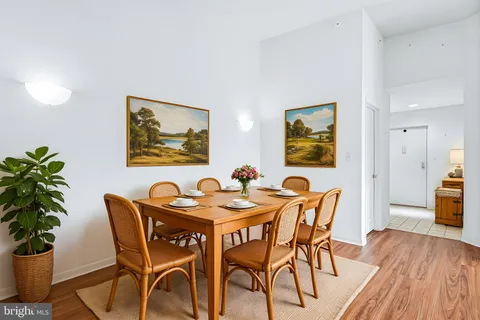 a view of a dining room with furniture and wooden floor