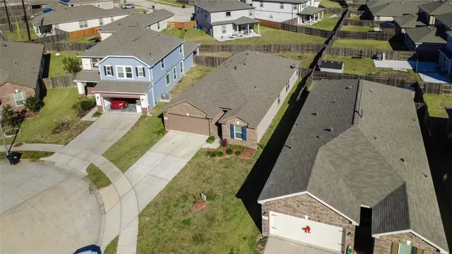 an aerial view of residential houses with outdoor space