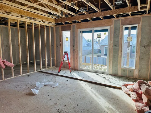 a view of a room with gym equipment and windows