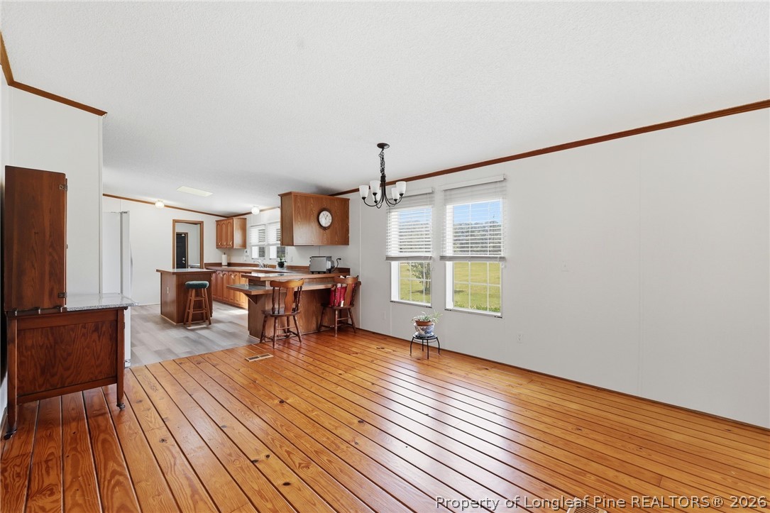 10400 Ruth Vinson Road Autryville, NC 28318 - Photo 26 of 49 a living room with furniture and a wooden floor